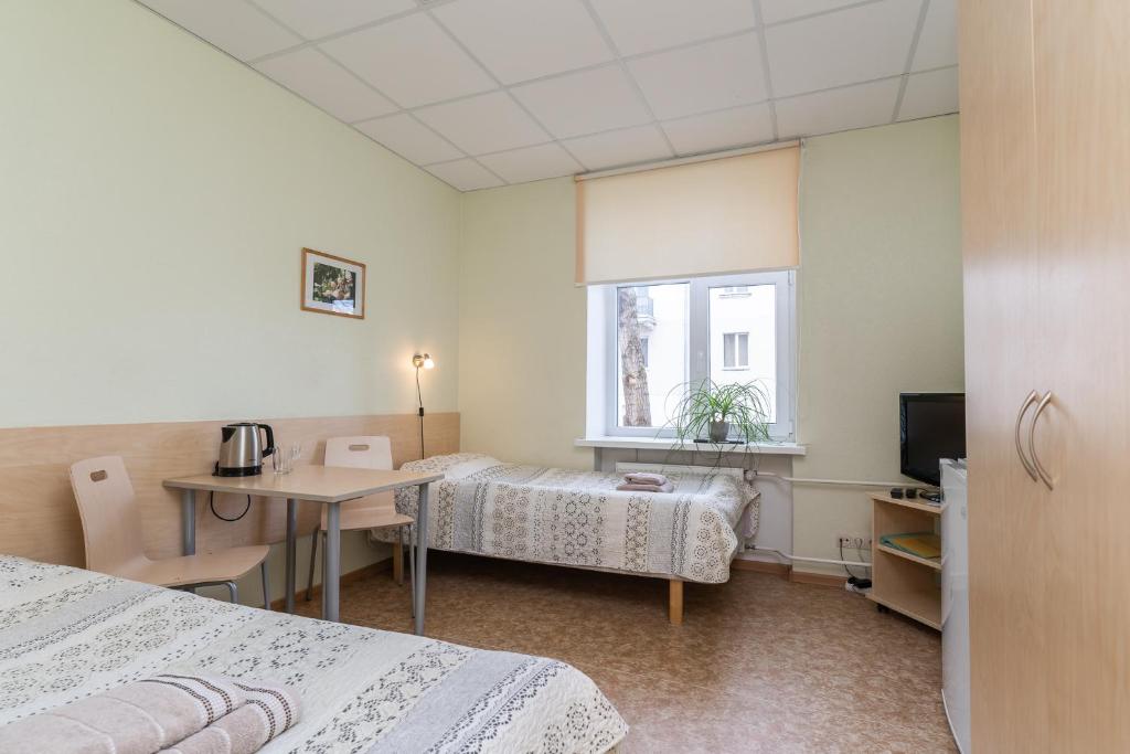 Postel nebo postele na pokoji v ubytování Virumaa Hostel