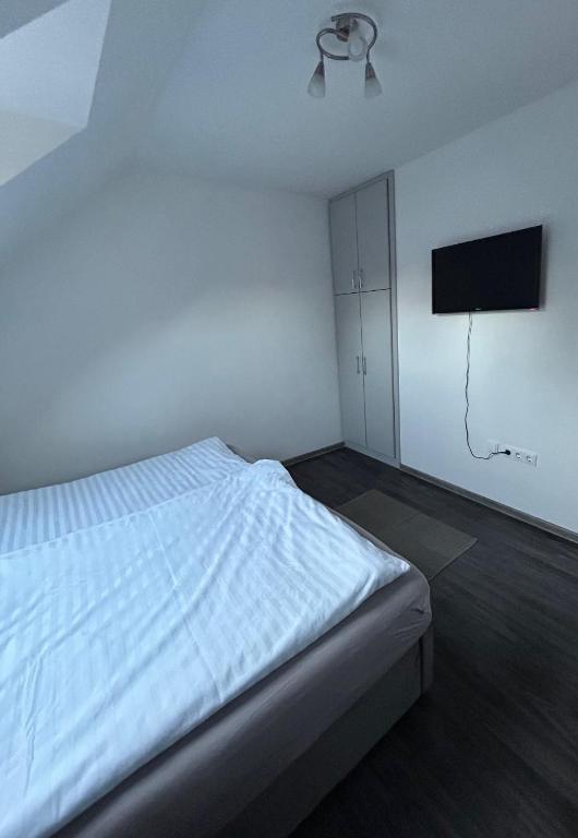 Posteľ alebo postele v izbe v ubytovaní Heni Apartment