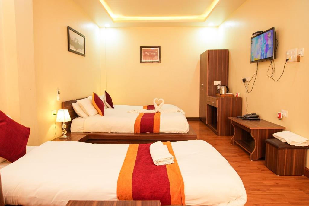 Postel nebo postele na pokoji v ubytování Hotel Edingo Inn