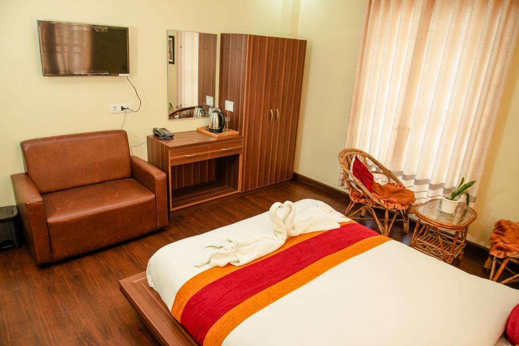Postel nebo postele na pokoji v ubytování Hotel Edingo Inn
