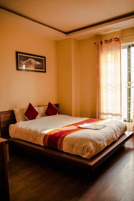Postel nebo postele na pokoji v ubytování Hotel Edingo Inn