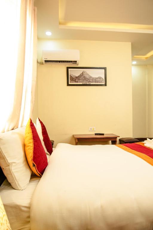 Postel nebo postele na pokoji v ubytování Hotel Edingo Inn