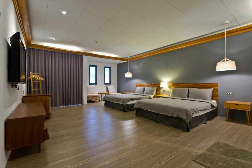 Rúm í herbergi á Kenting Cozy B&B