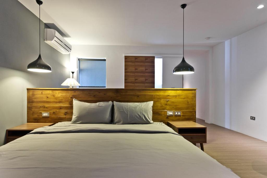 Rúm í herbergi á Kenting Cozy B&B