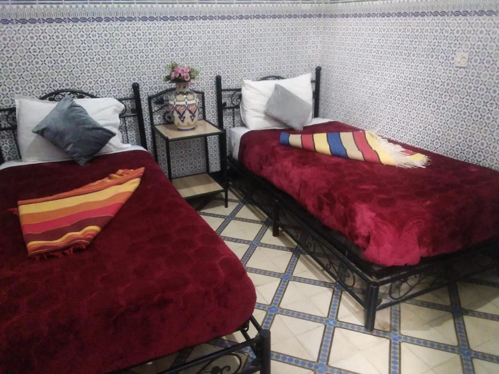 Postel nebo postele na pokoji v ubytování HOTEL EL AMAL