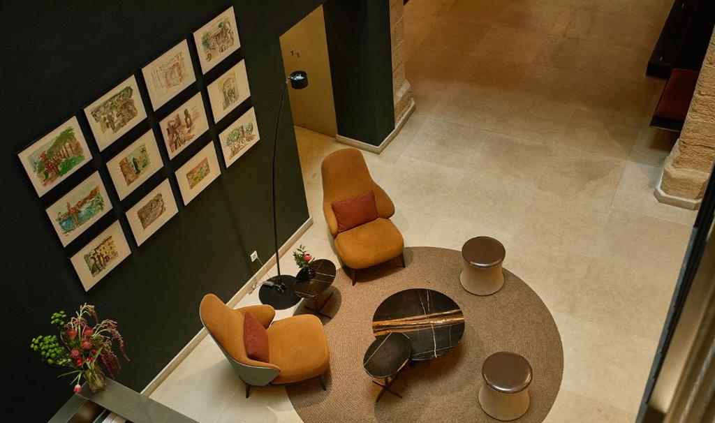 an overhead view of a living room with a table and chairs at Sant Jaume Design Hotel in Palma de Mallorca