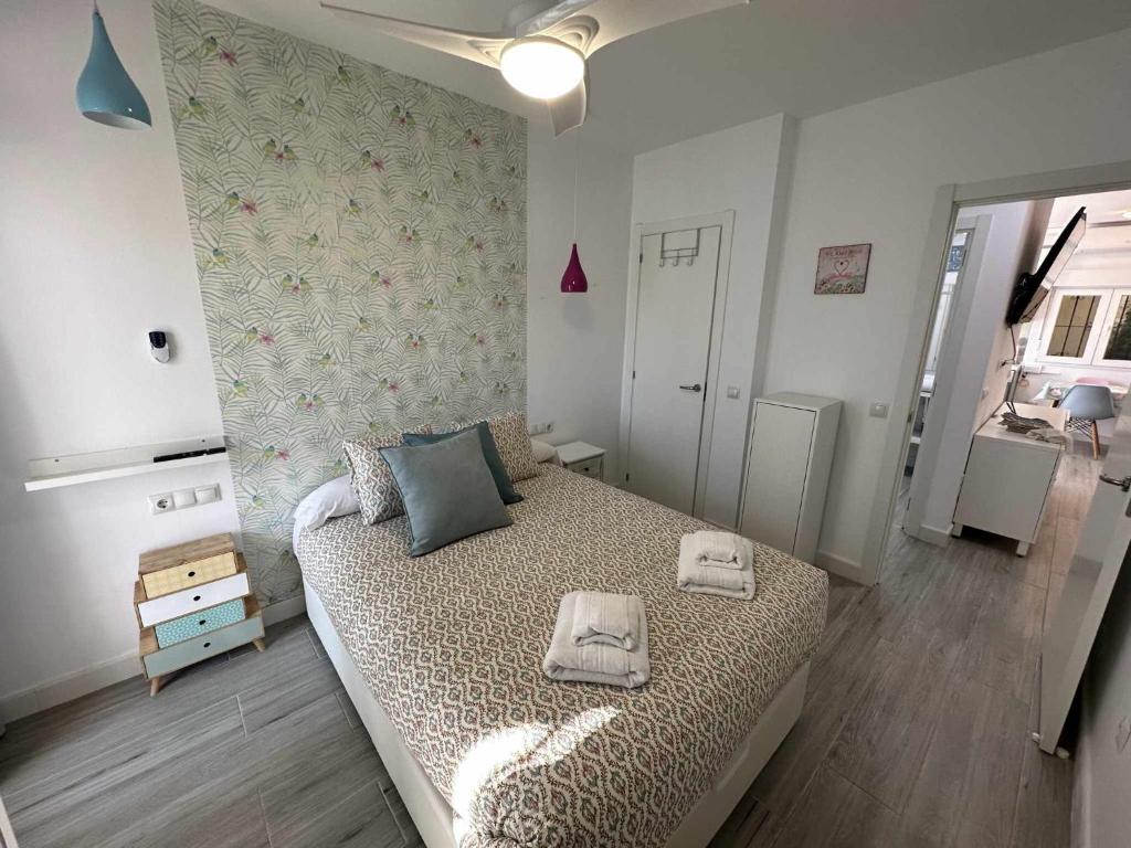 Posteľ alebo postele v izbe v ubytovaní Apartamento con jardín privado