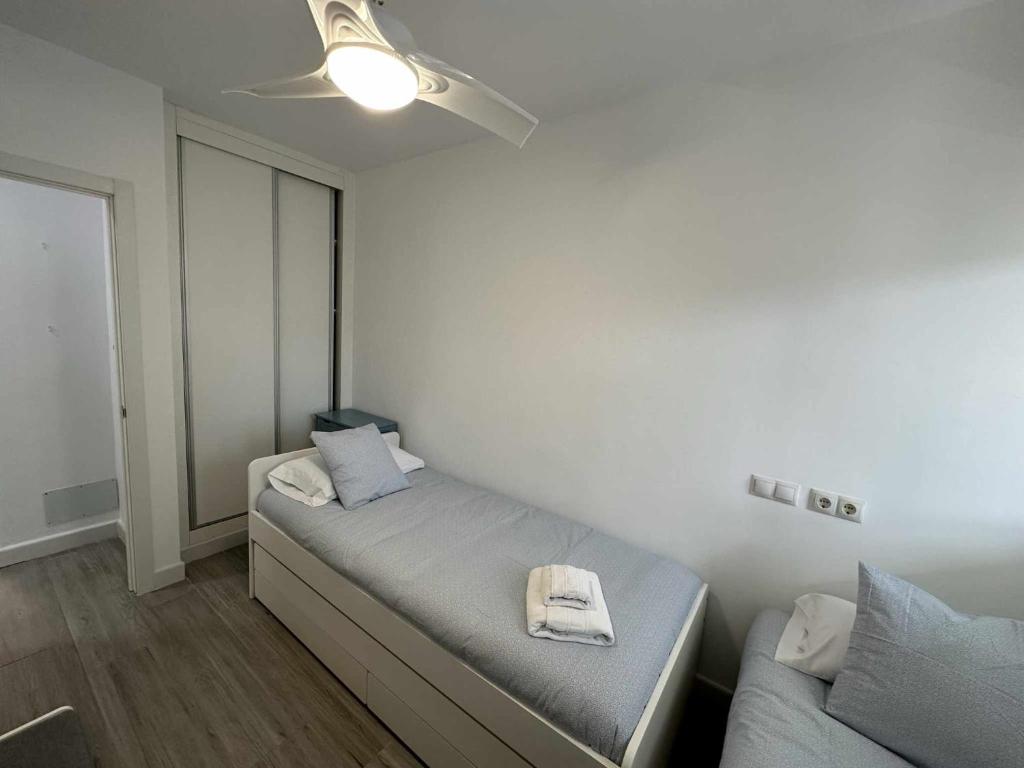 Posteľ alebo postele v izbe v ubytovaní Apartamento con jardín privado