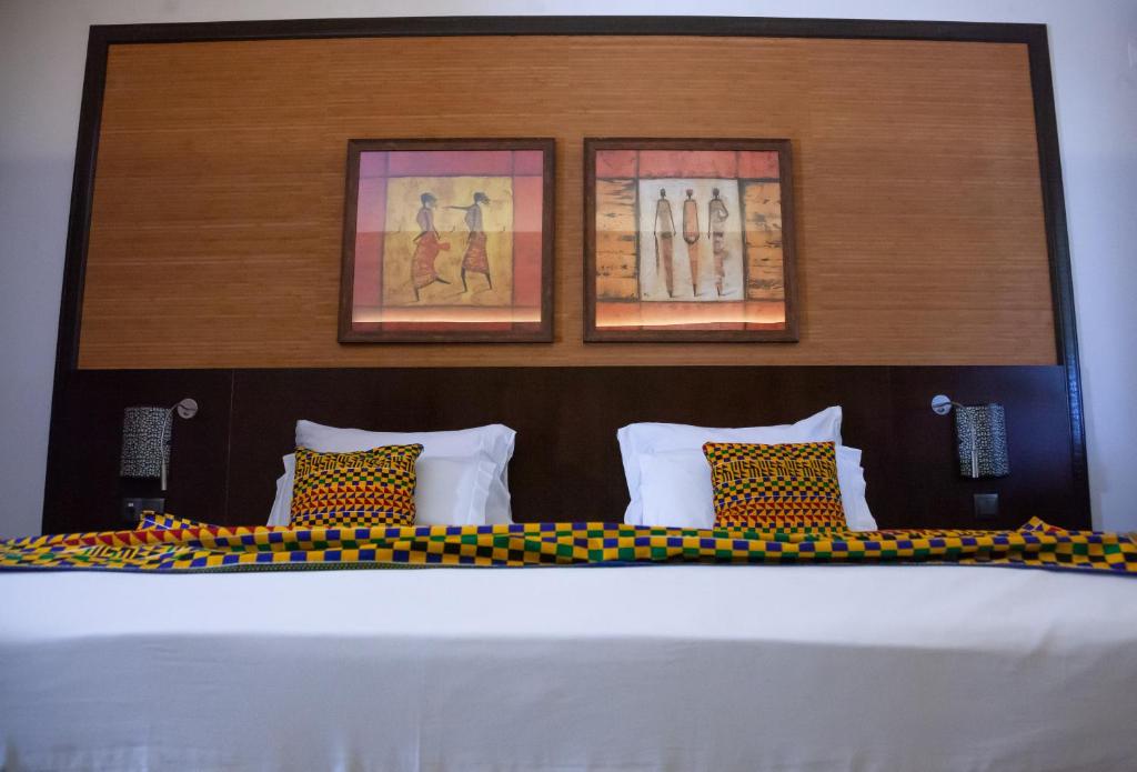 Postel nebo postele na pokoji v ubytování Pestana Tropico Ocean & City Hotel