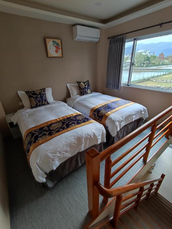 Postel nebo postele na pokoji v ubytování Zhuyuan Ju B&B