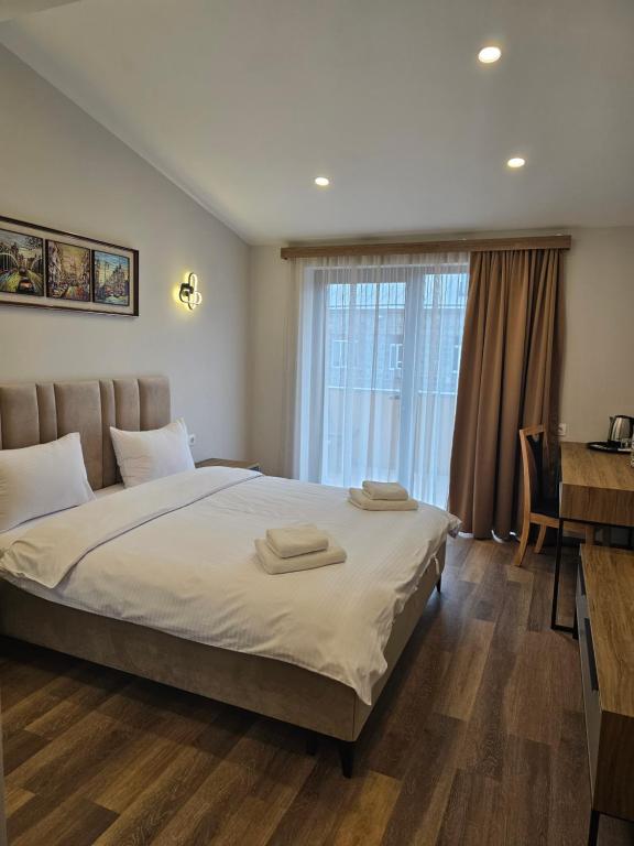 Postel nebo postele na pokoji v ubytování Hotel Avenue 30