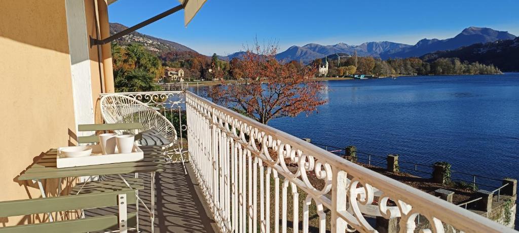 a balcony with a view of a lake and mountains at Casa Celeste by Quokka 360 - flat with a view of Lake Lugano in Caslano