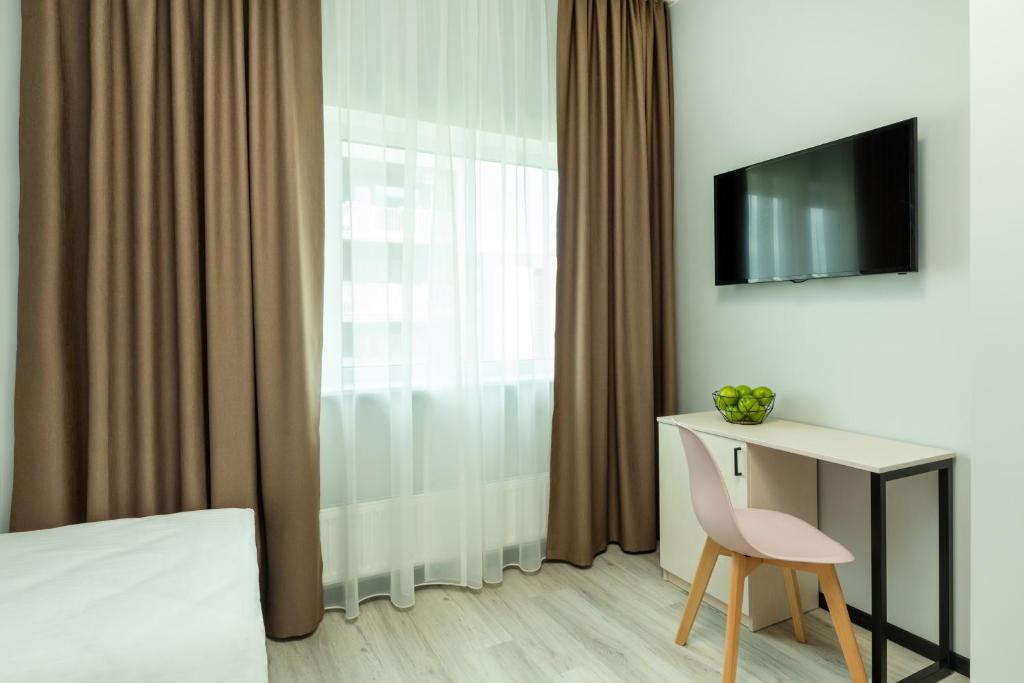 TV a/nebo společenská místnost v ubytování U11 Hotel & SPA