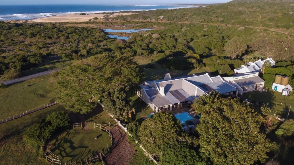 an aerial view of a large house on the beach at Oyster Bay Lodge in Oyster Bay