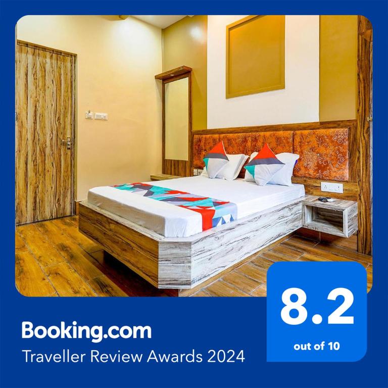 Postel nebo postele na pokoji v ubytování FabHotel Quest - Nr Quest Mall