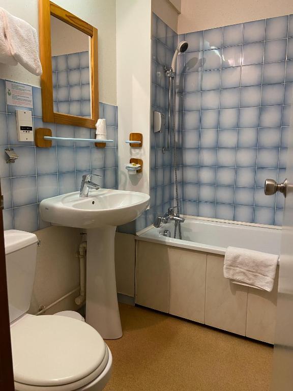 Koupelna v ubytování Hôtel Mélodie