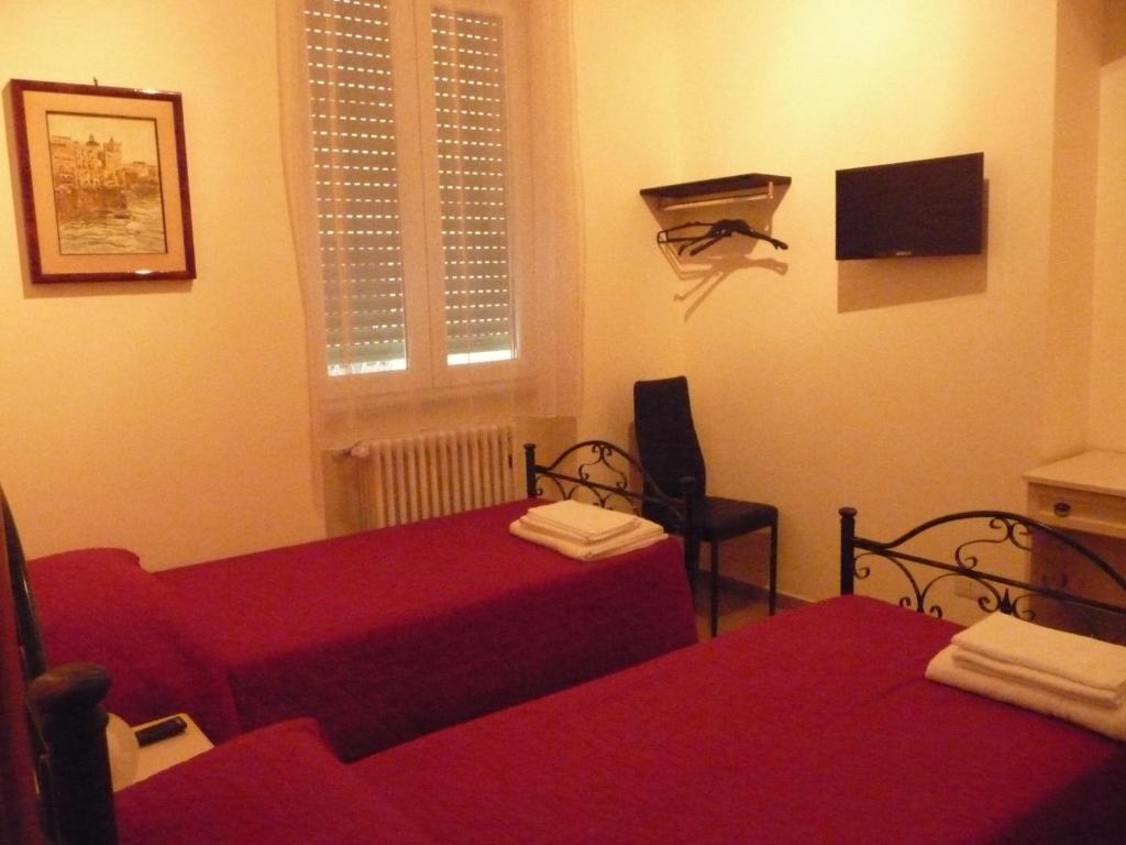 Postel nebo postele na pokoji v ubytování Le Due Nicchie