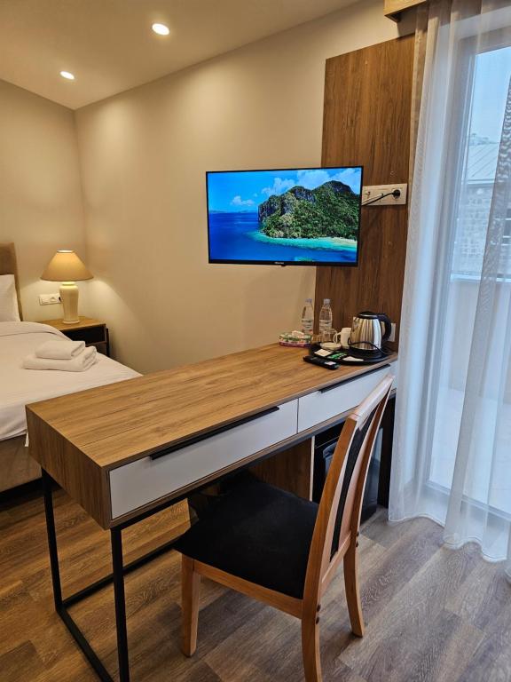 TV a/nebo společenská místnost v ubytování Hotel Avenue 30