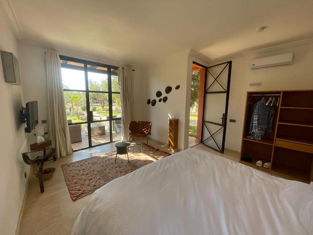 Uma cama ou camas num quarto em Kech-Montana