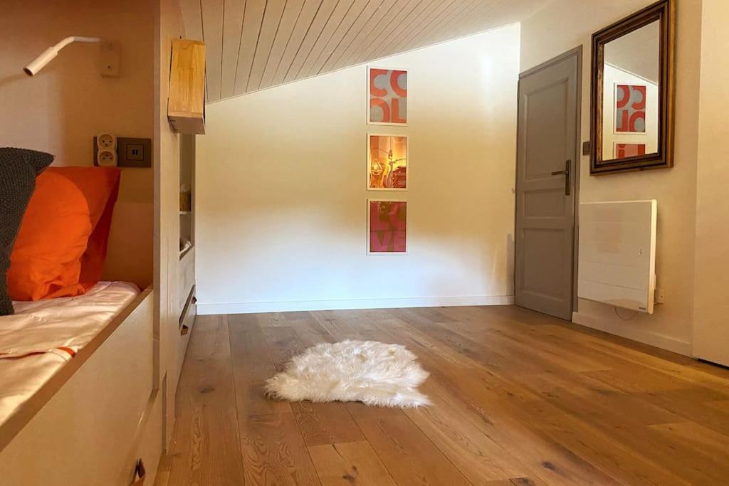 a white rug sitting on the floor of a room at Family cocoon Prime Rochebrune location in Megève