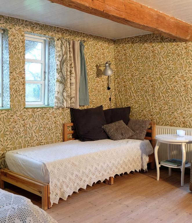 Postel nebo postele na pokoji v ubytování Millinge Gamle Skole
