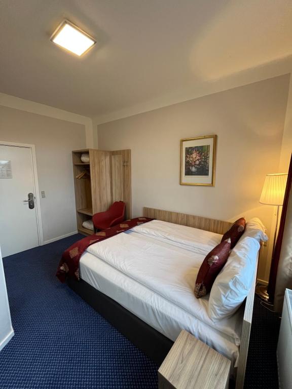 Postel nebo postele na pokoji v ubytování Hotel Skandia