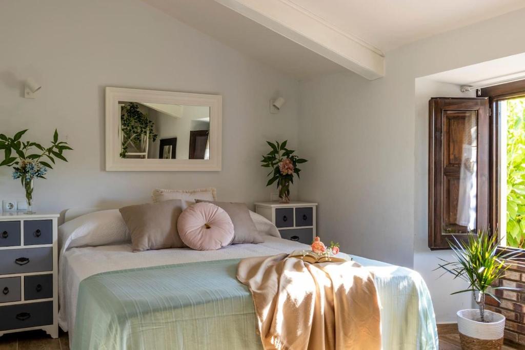 Llit o llits en una habitació de Apartamento para 4 con Jardín a 500m de la Playa