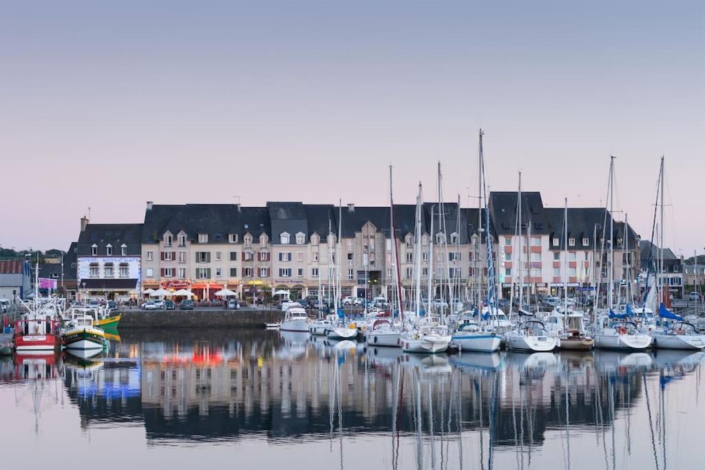 a bunch of boats are docked in a harbor at L&#39;Escale Paimpolaise 2 Étoiles - centre historique in Paimpol