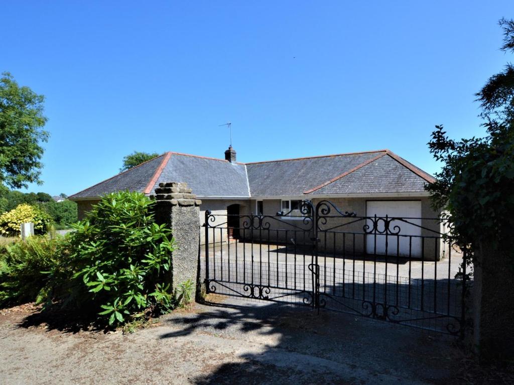 a house with a black gate and a driveway at 2 Bed in Constantine TVEAN in Constantine