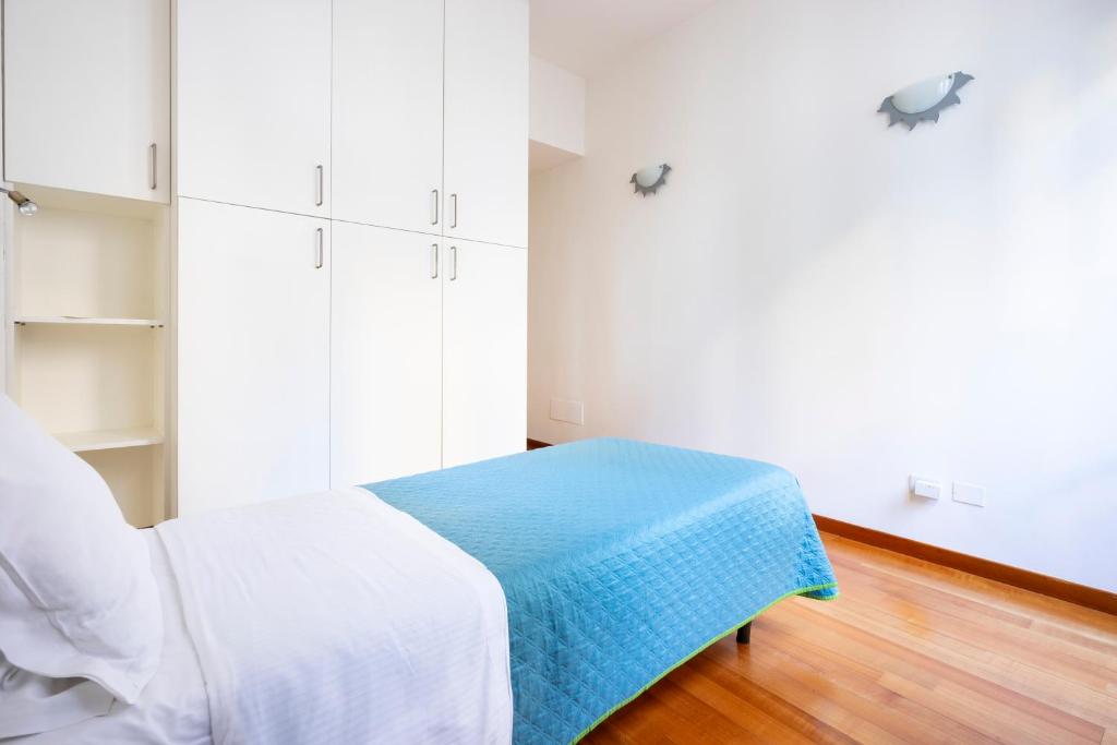 A bed or beds in a room at Sprone Apartment