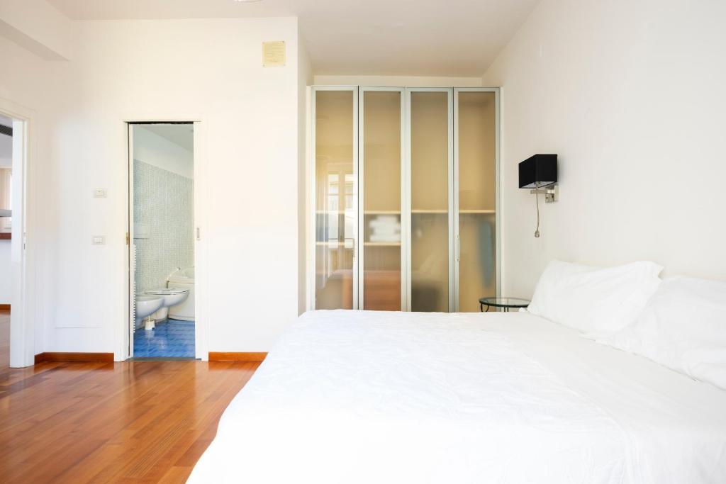 A bed or beds in a room at Sprone Apartment