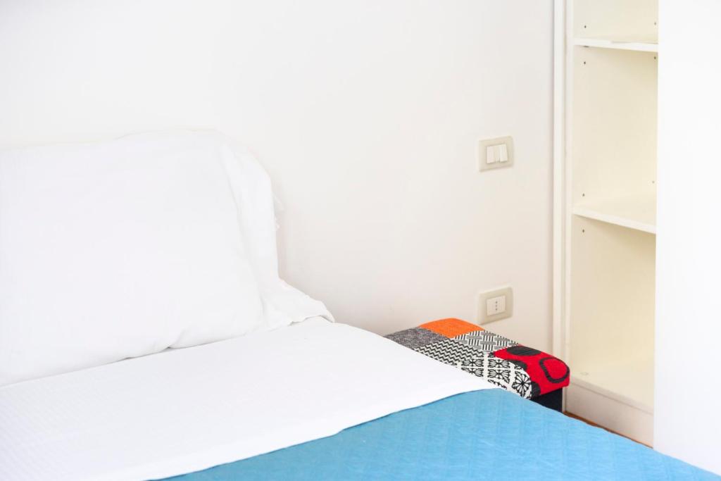 A bed or beds in a room at Sprone Apartment