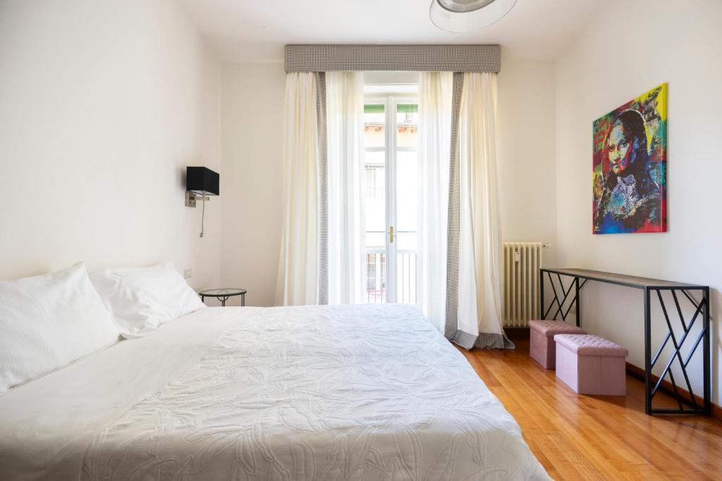 A bed or beds in a room at Sprone Apartment