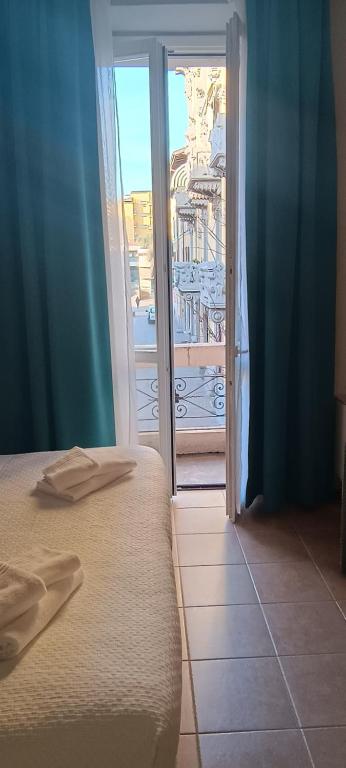 A bed or beds in a room at Hotel Nuovo Rondò