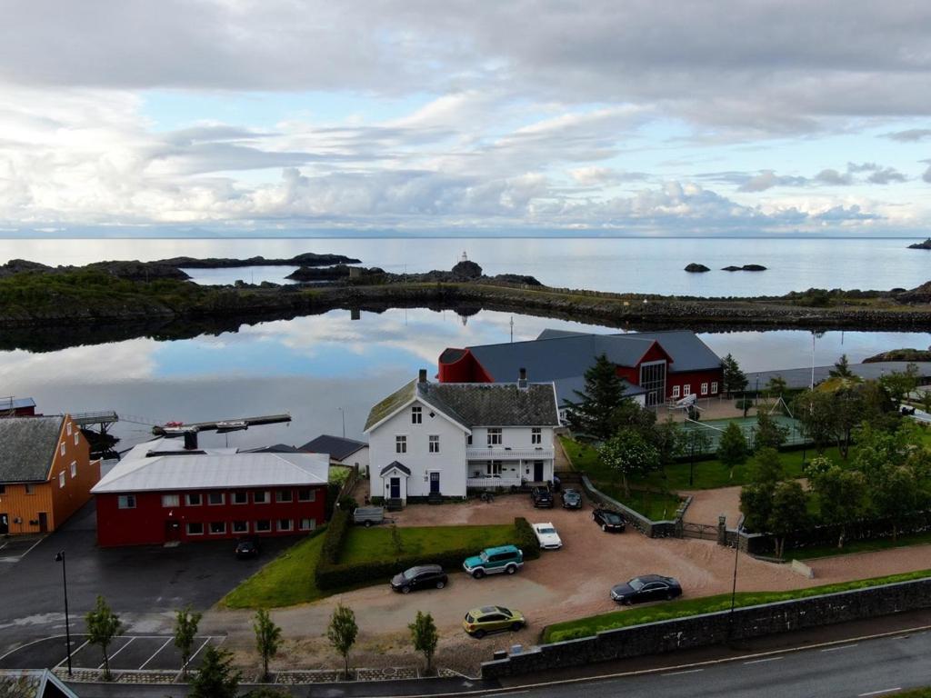 an aerial view of a town with a house and the water at Angelas Fjord Suite in Stamsund