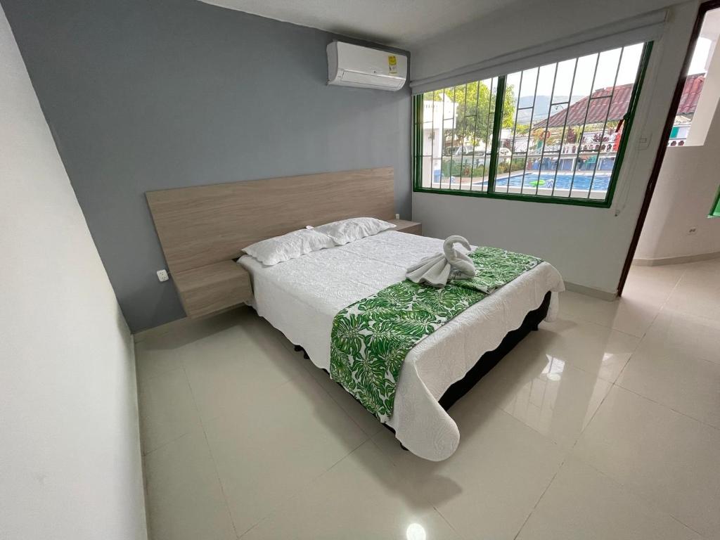 Postel nebo postele na pokoji v ubytování Hotel Maratea Melgar