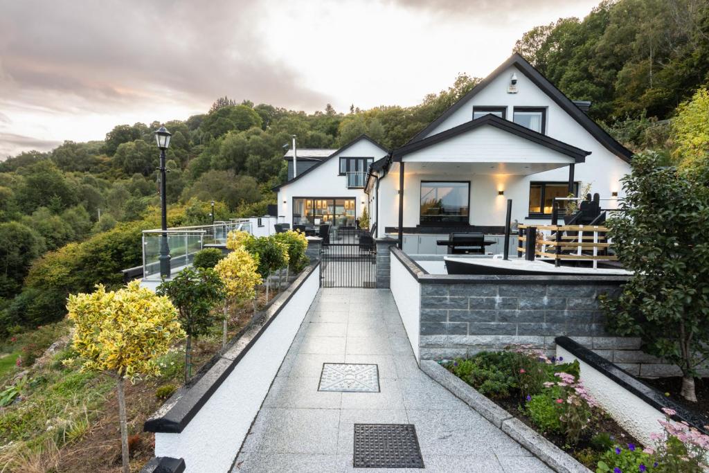 a house on a hill with a walkway at Fern View in Inverness