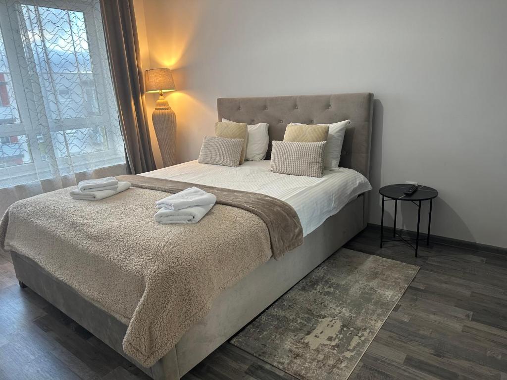 Ένα ή περισσότερα κρεβάτια σε δωμάτιο στο Happy Home Avantgarden