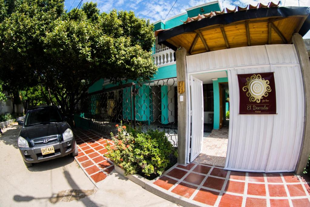 a car parked in front of a building at Casa El Dorado in Santa Marta