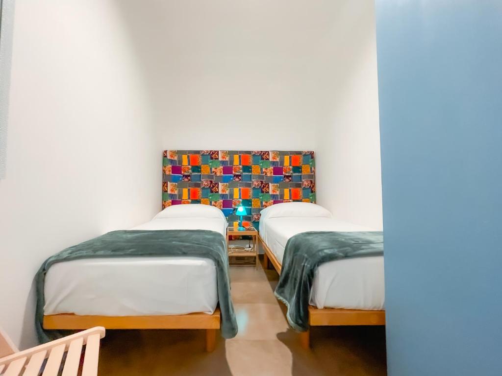 Postel nebo postele na pokoji v ubytování Casa Sorelle Maricò