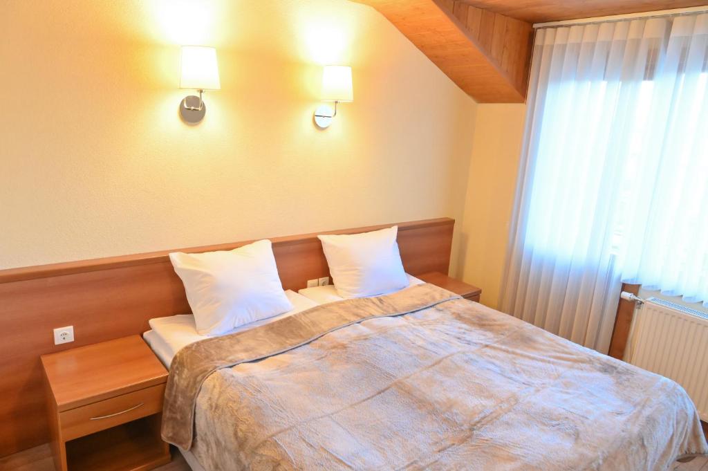Postel nebo postele na pokoji v ubytování Къща за гости ГРАНИТ