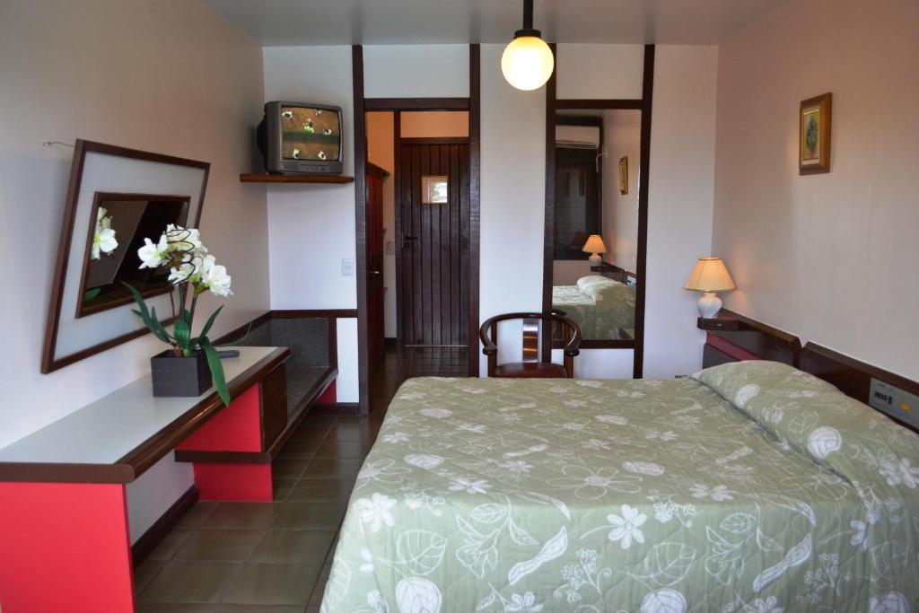 Postel nebo postele na pokoji v ubytování Baia Cabralia Hotel
