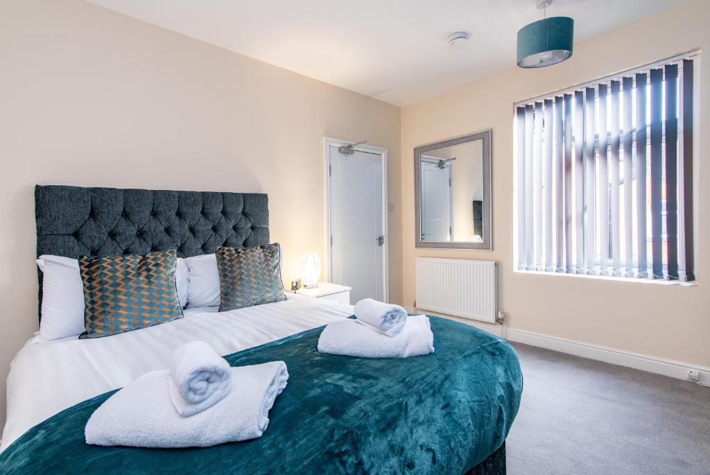 מיטה או מיטות בחדר ב-2 Bedroom House in the Heart of Leicester