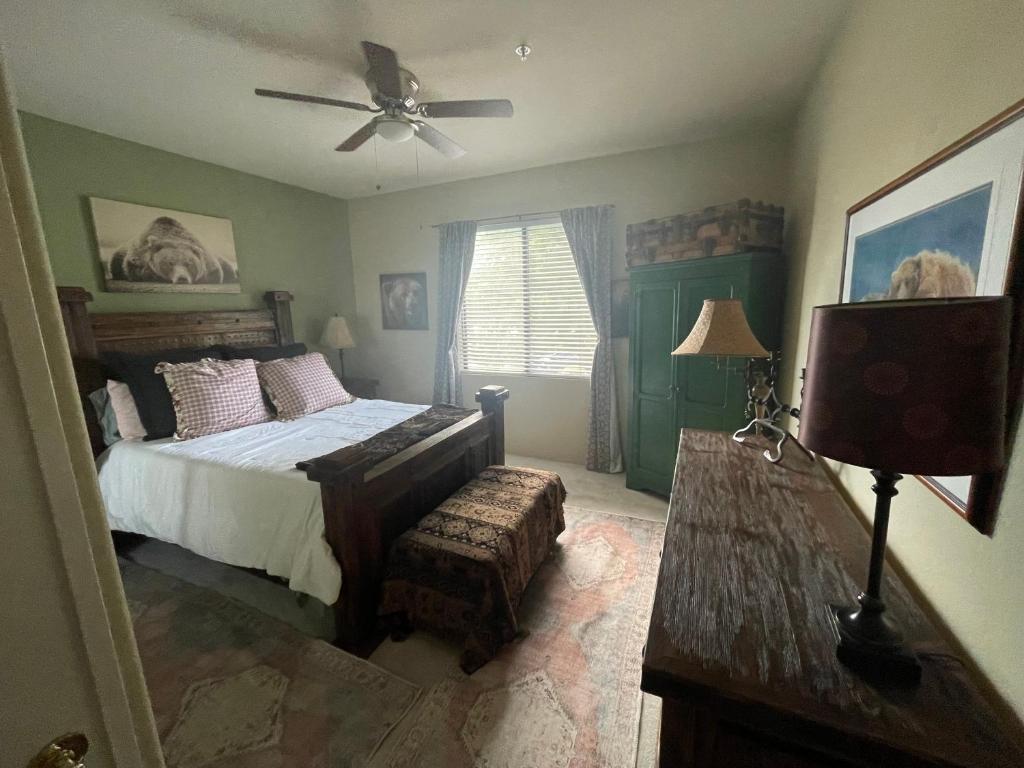 a bedroom with a bed and a ceiling fan at Scottsdale Retreat in Scottsdale