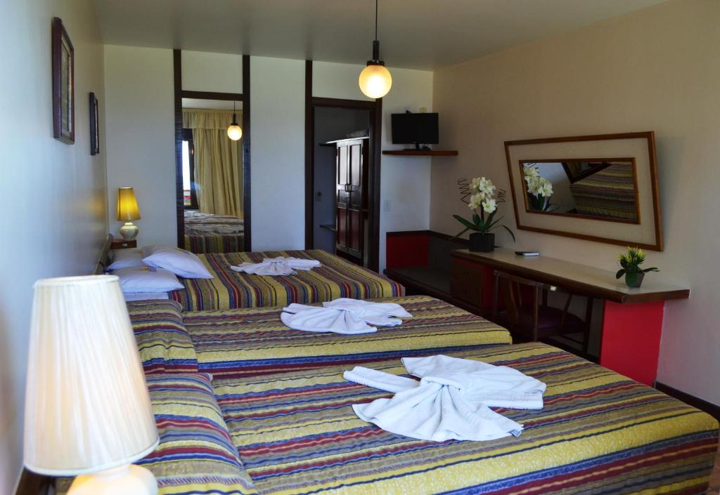 Postel nebo postele na pokoji v ubytování Baia Cabralia Hotel