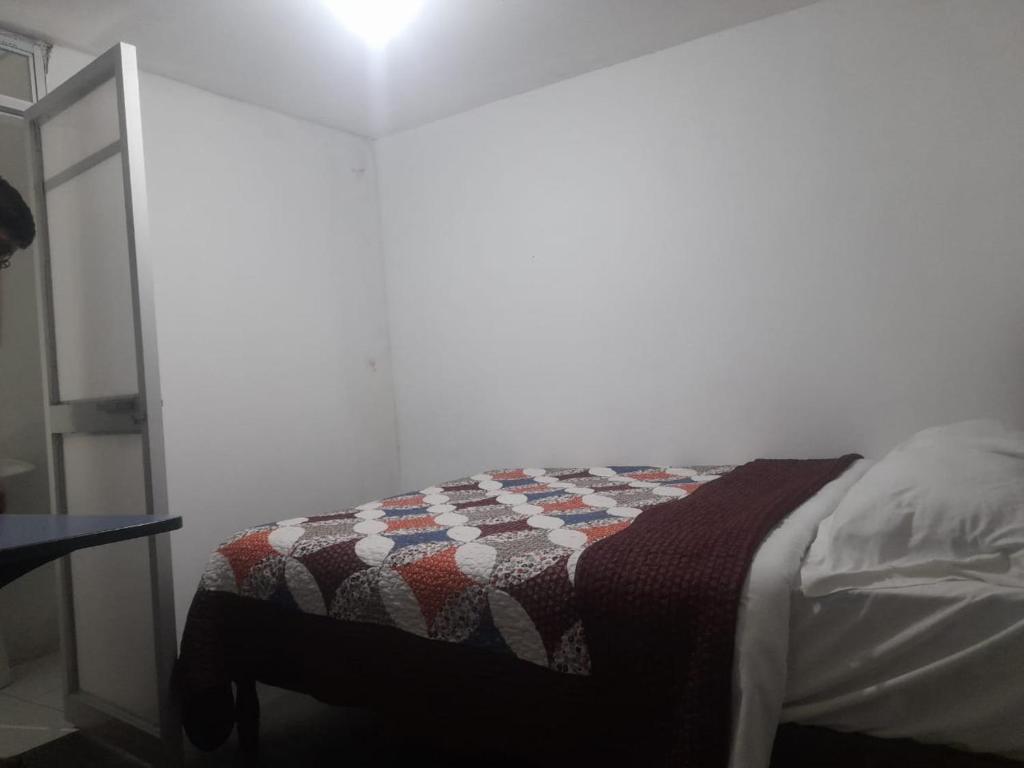 Кровать или кровати в номере HOTEL PHUYUTARKI