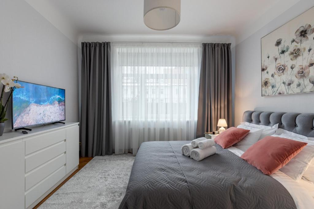 מיטה או מיטות בחדר ב-Apartment in a renovated property, 30 m2