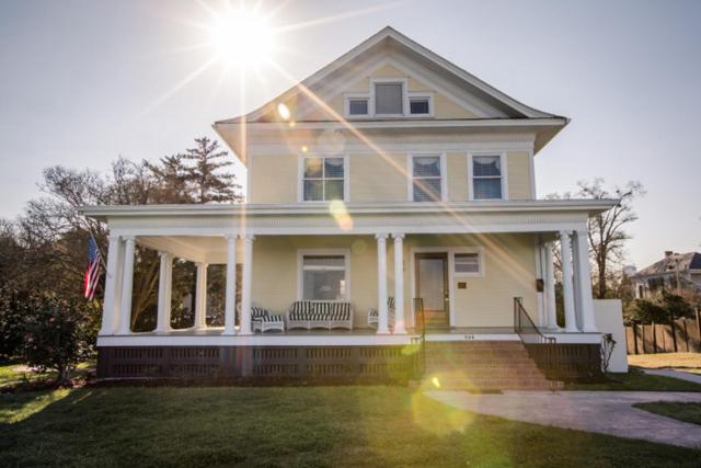 a white house with the sun shining on it at Clifton House - Panorama - Queen Suite, Sleeps 4, River Views in Natchez