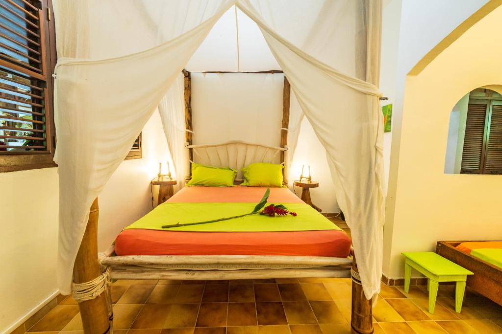 Postel nebo postele na pokoji v ubytování Martinique Treehouse
