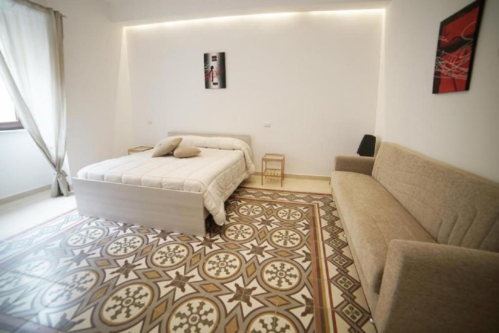 Postel nebo postele na pokoji v ubytování Basilicata Host to Host - Matera Charme Rooms